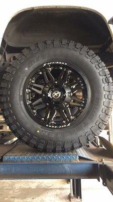 Aftermarket wheels and tires.