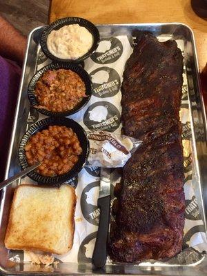 Ribs, baked beans, potato salad, toast, and Brunswick stew