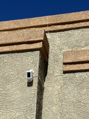 Ring Spotlight Camera installed w/ cable hidden and solar panel installed on the roof.