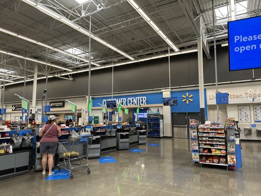 Check out area with blue markings on the floor where to put your cart.