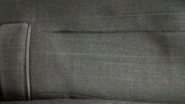 stretched suit coat seam/frayed, ?burned threads