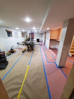 Basement remodel protecting the floors is a must when working in finished homes.