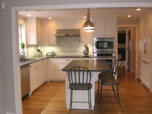 This kitchen was slightly enlarged during the remodel with a bump out and now flows into the newly added eating area!