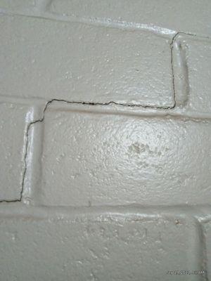 Room wall caving in structural damage