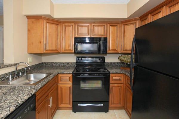 Kitchens include electric appliances - stove, refrigerator, dishwasher & microwave