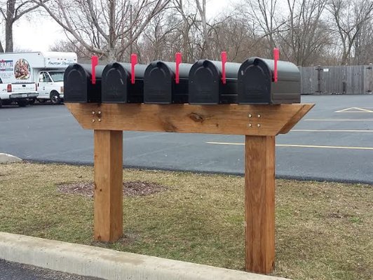 Mailbox Remedies installs a custom cedar mailbox post with 5 mailboxes. Mailbox installation for Businesses, Associations and Homeowners.