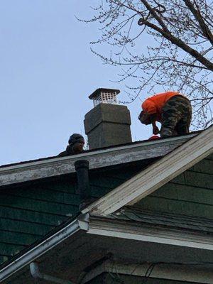 Our chimney repair experts work on top of a homeowner's roof. The project was to replace the leaking concrete chimney over 25 years old.