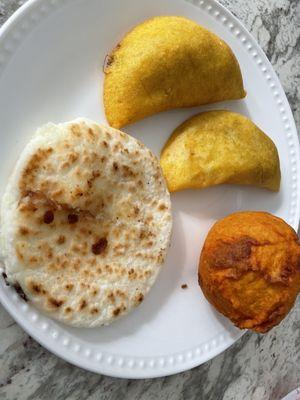 Arepa with white corn masa, empanadas, patatas rellenos