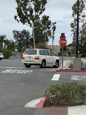 Reckless driver- white middle-aged blonde female driving gold Lexus with license plate 76CH799.