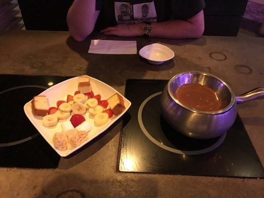 Milk chocolate fondue with all the sides  pound cake, rice crispy, strawberries, bananas and marshmallow!