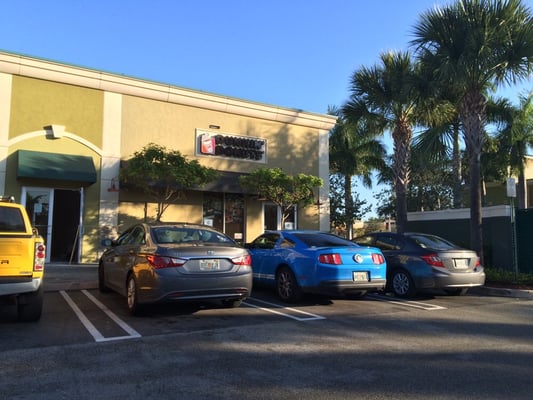 Backside of Dunkin Donuts where you park. It can be tricky to find. It's across the street from Publix in Gateway near I95.