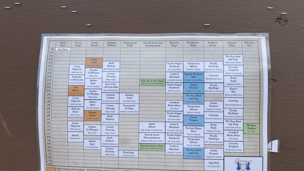 EXAMPLE schedule of the acts you could see, listed in white, blue, green, and orange, with time and place.