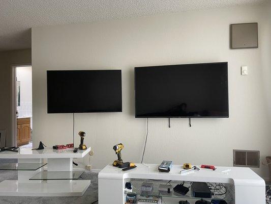 Two flat screens mounted for entertainment and gaming