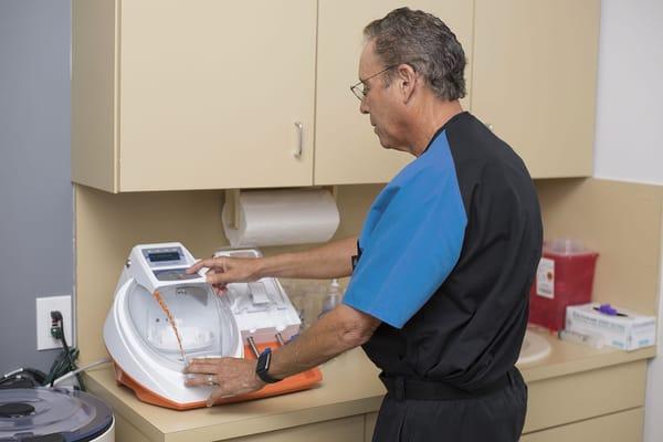 Dr. Bruce Stratt Using Centrifuge for PRP