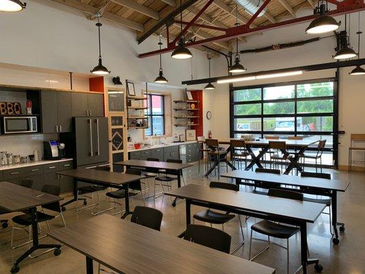 Training Room, Kitchen, Bar Area, and Garage Door leading to Built-In Grill and Fire Pit!