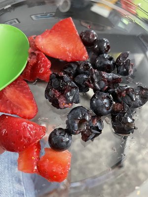 Mushy rotten blueberries and fermenting strawberries