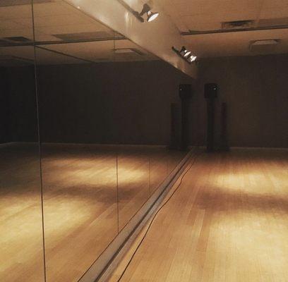 The back studio. All studios hardwood floors with full wall mirrors and adjustable lights.