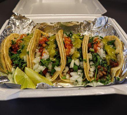 1 Carnitas Taco (Pork), 1 Tripas Taco, 1 Barbacoa (Beef) Taco and 1 Alpastor Taco (marinated pork).