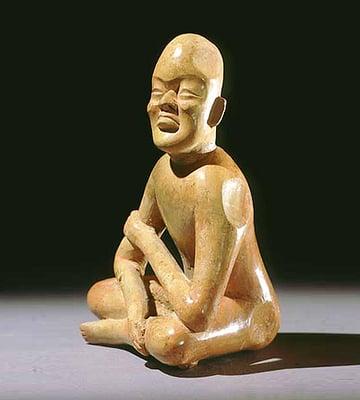 Seated Olmec figure at the Merrin Gallery, likely originating in the archeological site Las Bocas, ca. 1200-900 BC.