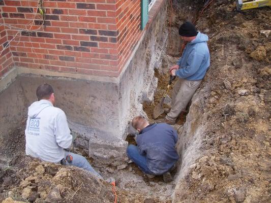 Preparing to stabilize a failed foundation.  We can repair concrete block and poured concrete foundations.