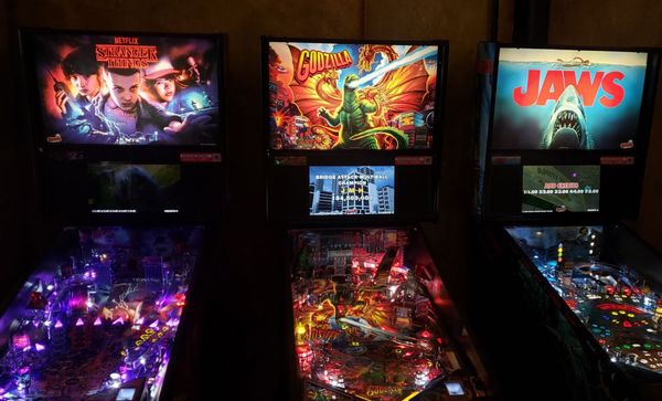 Garage Band's latest lineup of pinball tables as of May '24. Stranger Things, Godzilla, Jaws ($1/game)