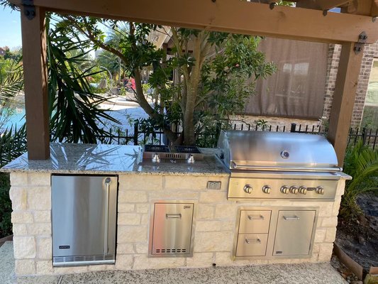 Custom made outdoor kitchen with pergola