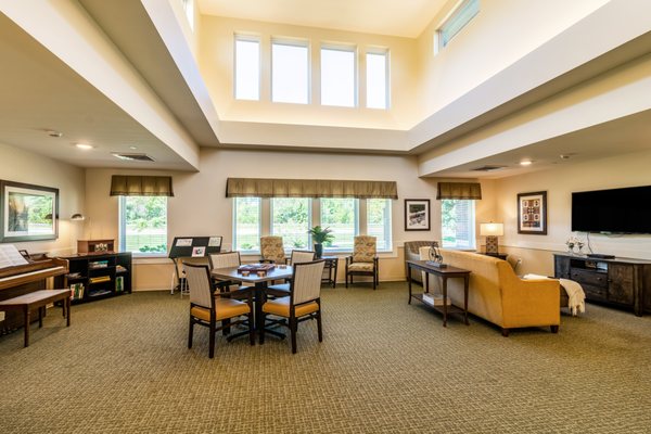 Multiple lounge areas for activities and relaxation.