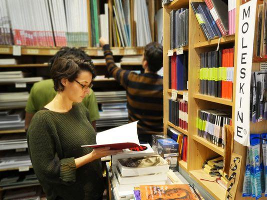 A variety of paper for drawing and painting and a selection of sketch books and notebooks.