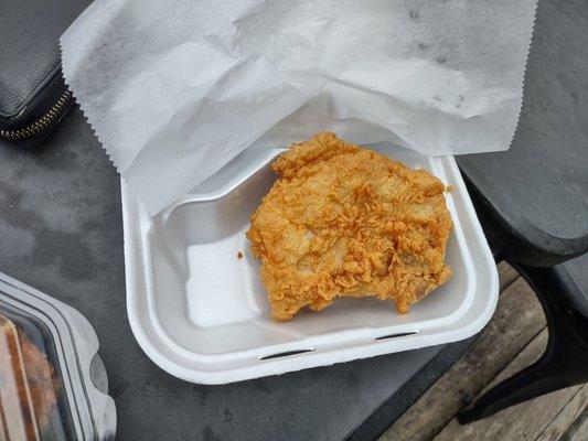 One piece of fried pork chop. This was expertly cooked. Very tender and juicy. Still hot.