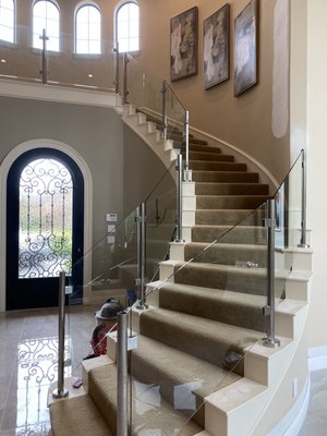 Custom glass stair rail for personal home.