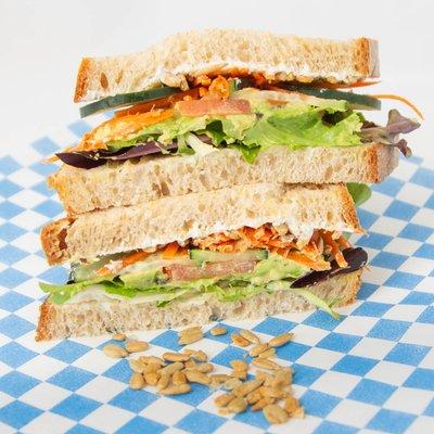 Veggie Sandwich - The Original w/cream cheese, sunflower seeds, shredded carrots, field greens, tomato, cucumber, avocado (+turkey option)