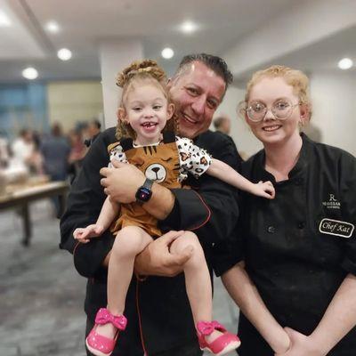 Myself and my daughter at my competition, with the iron chef of America.