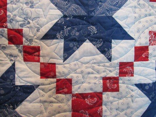 This is a scrappy quilt machine pieced my Nancy Klump and Quilted by Owl Night Longarm Quilting (Jill Kirkland).