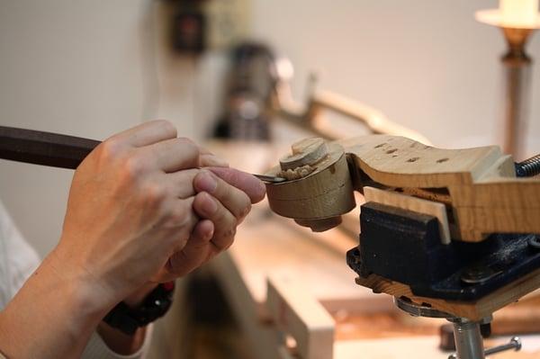 Making cello scroll.