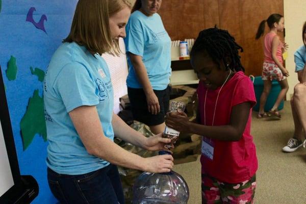 Collecting coins for Living Water for The World during Vacation Bible School