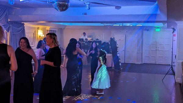 DJ Fila working a wedding in his jeans, white shirt and backwards baseball cap