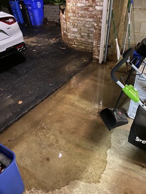 Water pouring in garage after heavy rains.