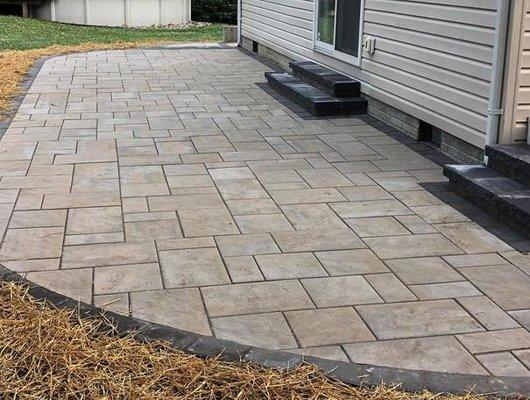 Bluestone patio installation along with replacing steps leading up to entrances.