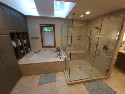 Beautiful walk in shower with lots of built in storage!