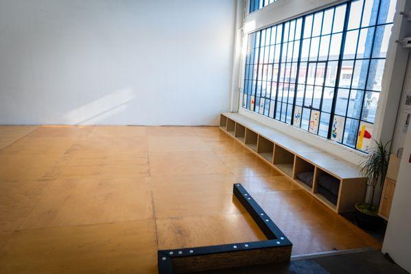 Studio East birch wood floor with ADA-accessible ramp