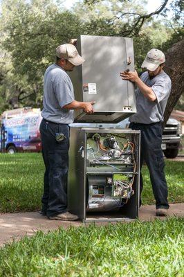 LPI Service Techs preparing to install an HVAC system.