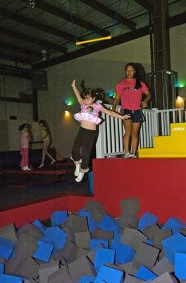 Trapeze swing with foam pit is a blast!