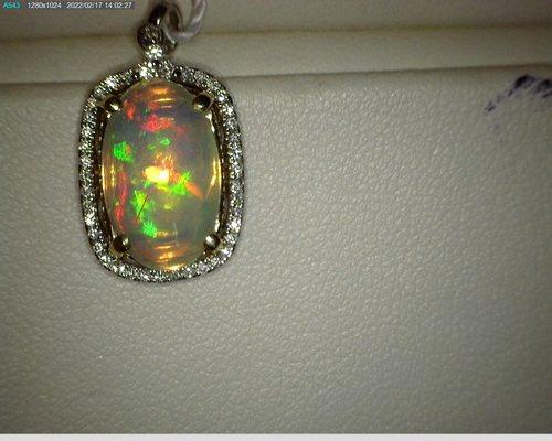 opal and diamond pendant set in gold.