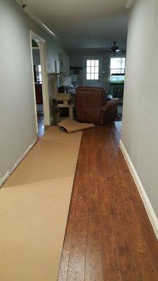 Protecting new laminated floor to prepare the area to  painting