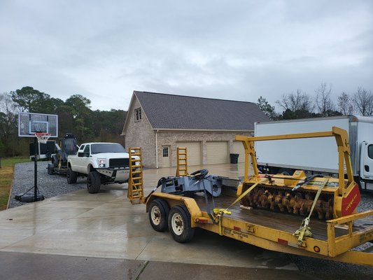 mulcher, stump grinder, for forestry work. we also do tree removal and grading.