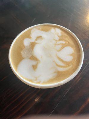 A cappuccino with a seahorse design made by Kaylin