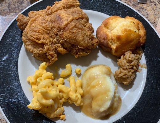 Chicken, biscuit, mashed potatoes and gravy, macaroni and cheese, and jambalaya.