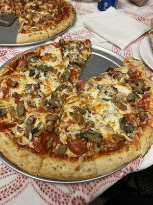 Large pepperoni, sausage, and mushroom pizza