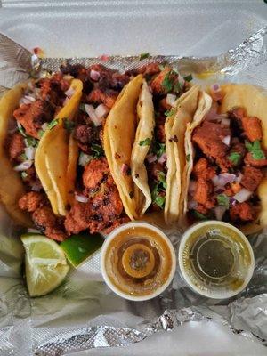 4 al pastor tacos $12