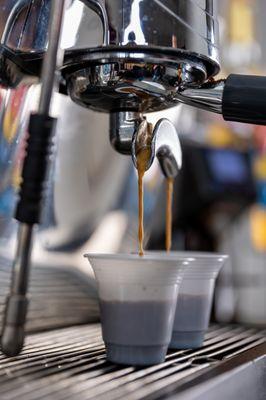 double espresso pour closeup for coladas and iced and hot espressos